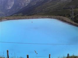 A swimming pool with spectacular views behind the lower restaurant at Kleinn Scheidegg